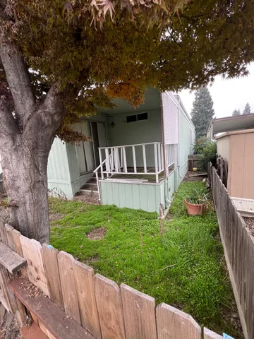 a view of an empty room with a fireplace