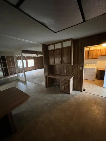 a view of a livingroom with furniture and a ceiling fan