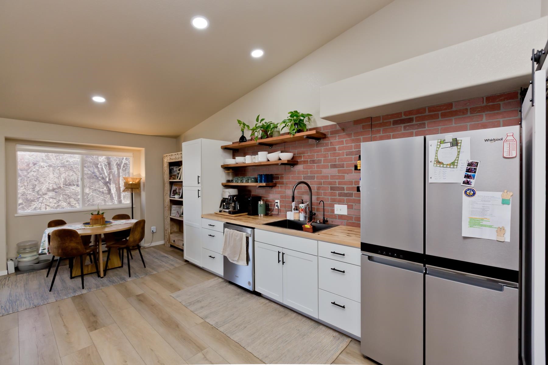 528 Park Ridge Court Grand Junction, CO 81507 - Photo 12 of 42 a kitchen with white cabinets and white appliances