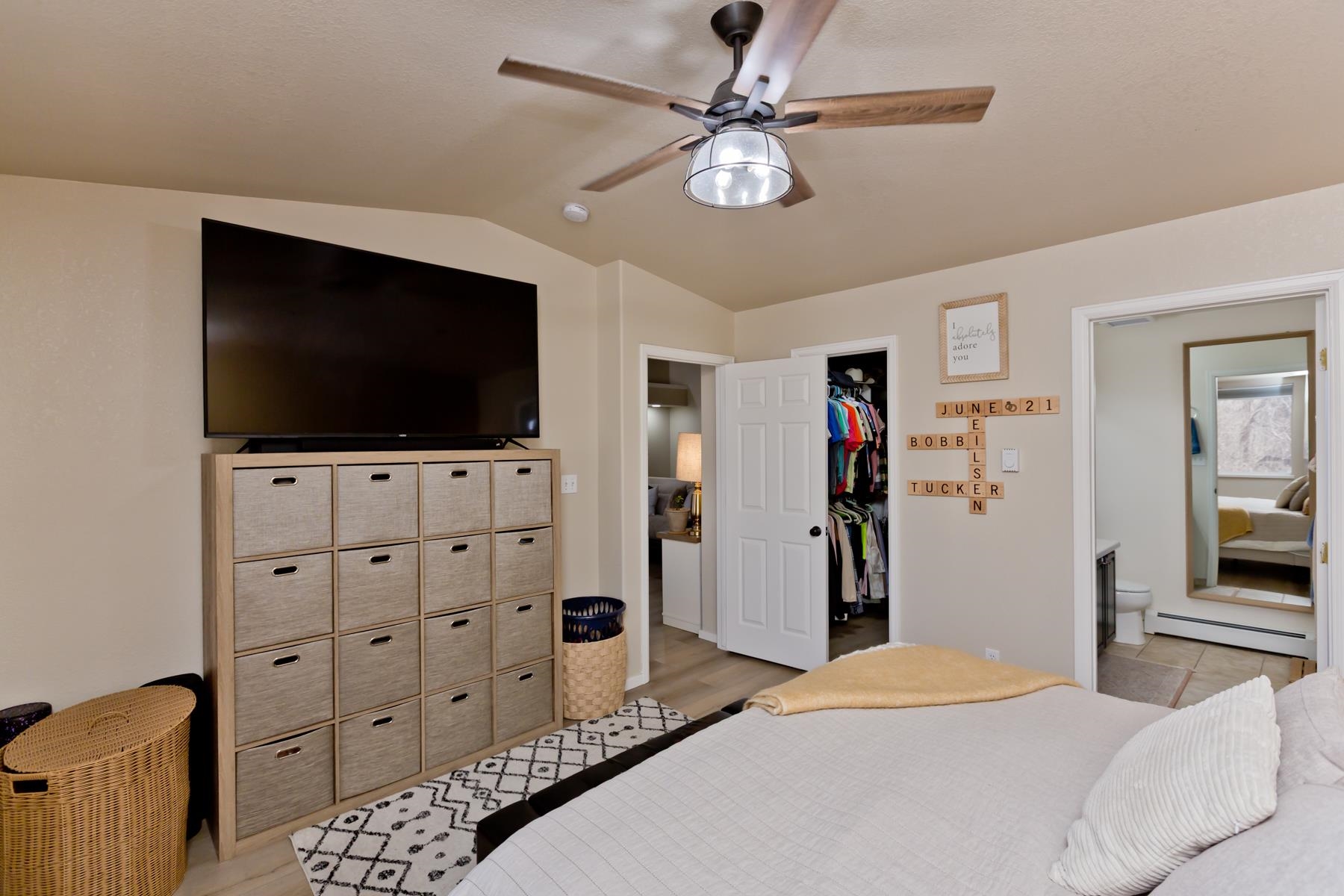 528 Park Ridge Court Grand Junction, CO 81507 - Photo 17 of 42 a bedroom with a bed and a flat screen tv