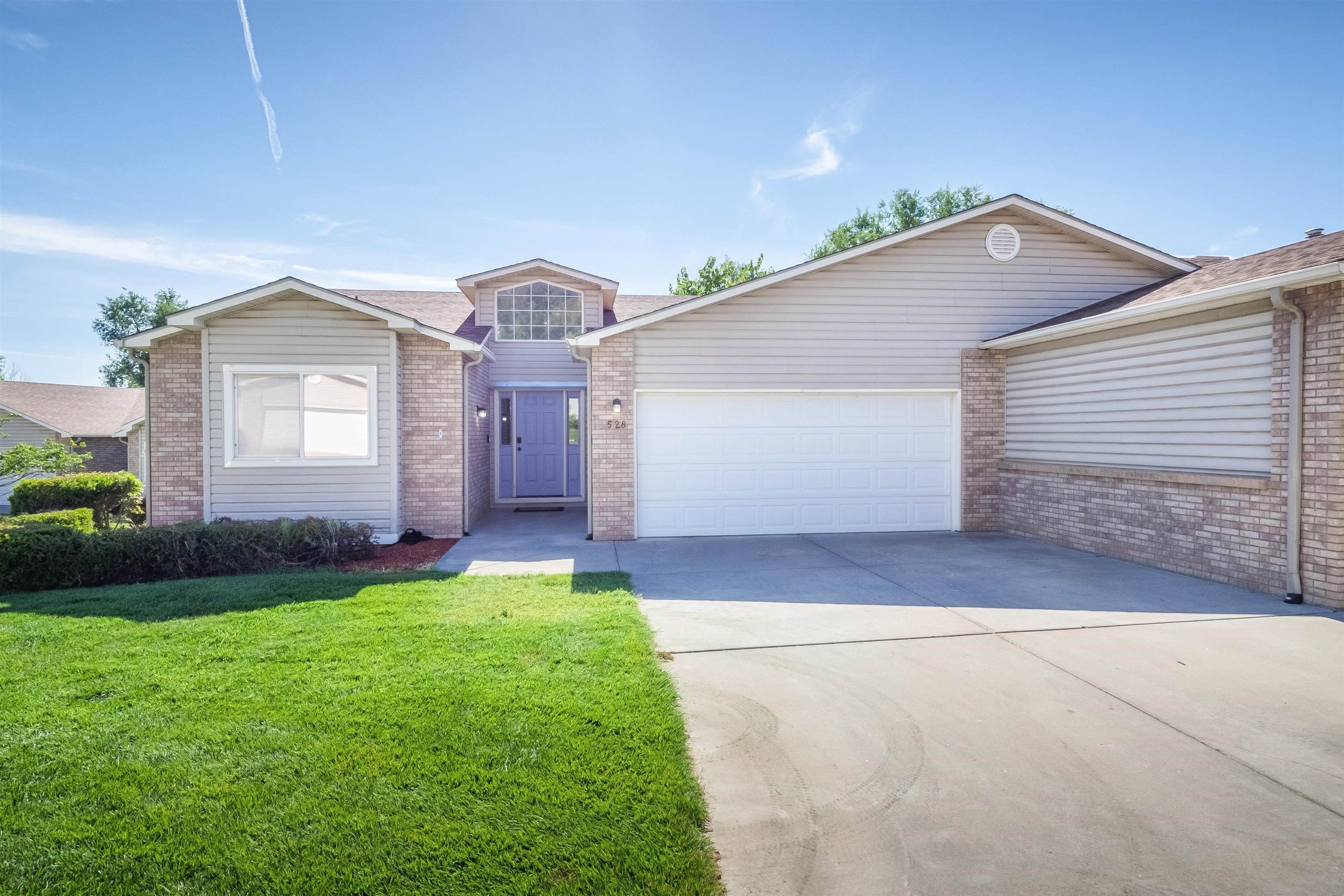 528 Park Ridge Court Grand Junction, CO 81507 - Photo 2 of 42 a front view of a house with a yard and garage