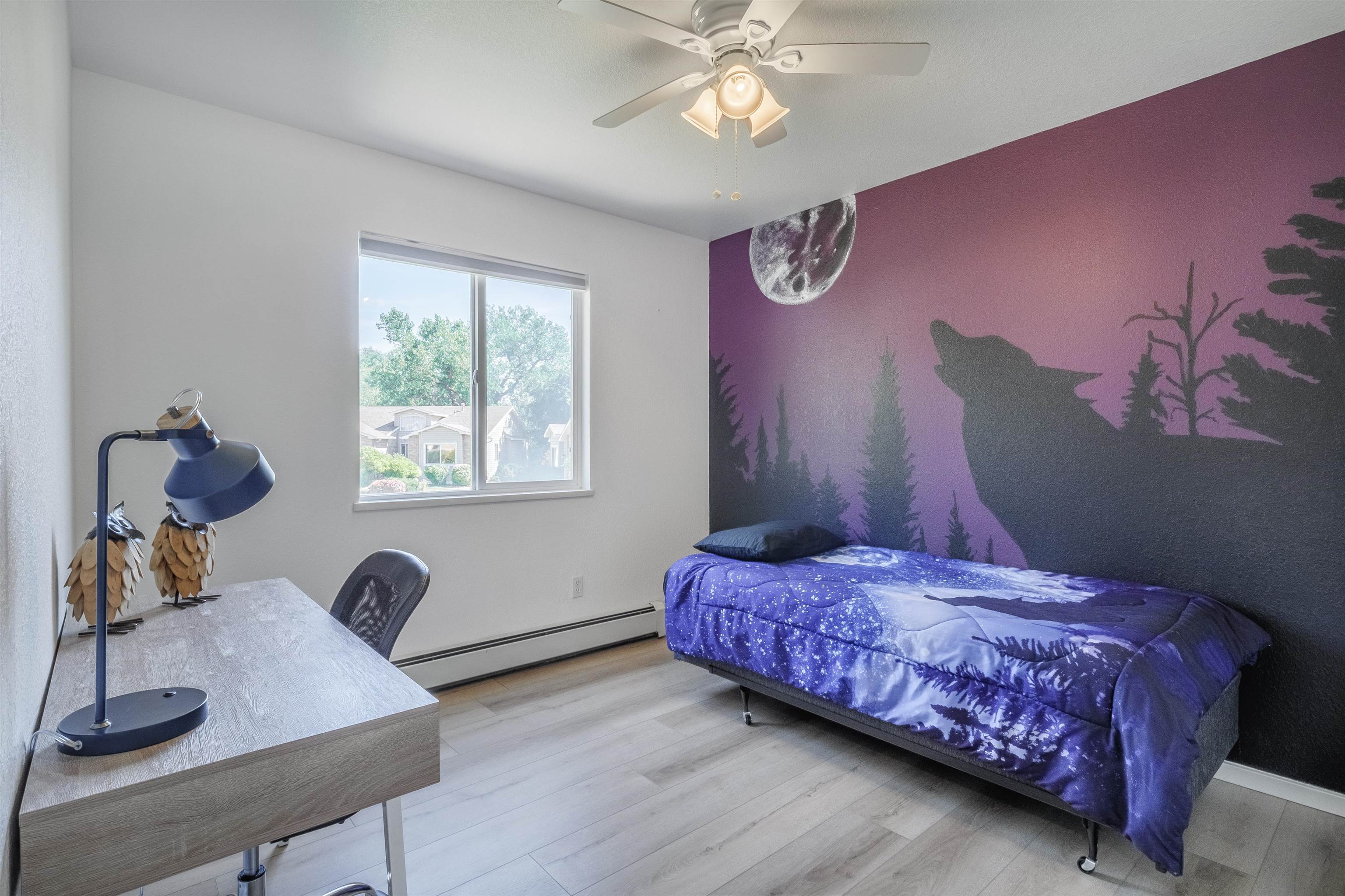 528 Park Ridge Court Grand Junction, CO 81507 - Photo 23 of 42 a bedroom with a bed and wooden floor