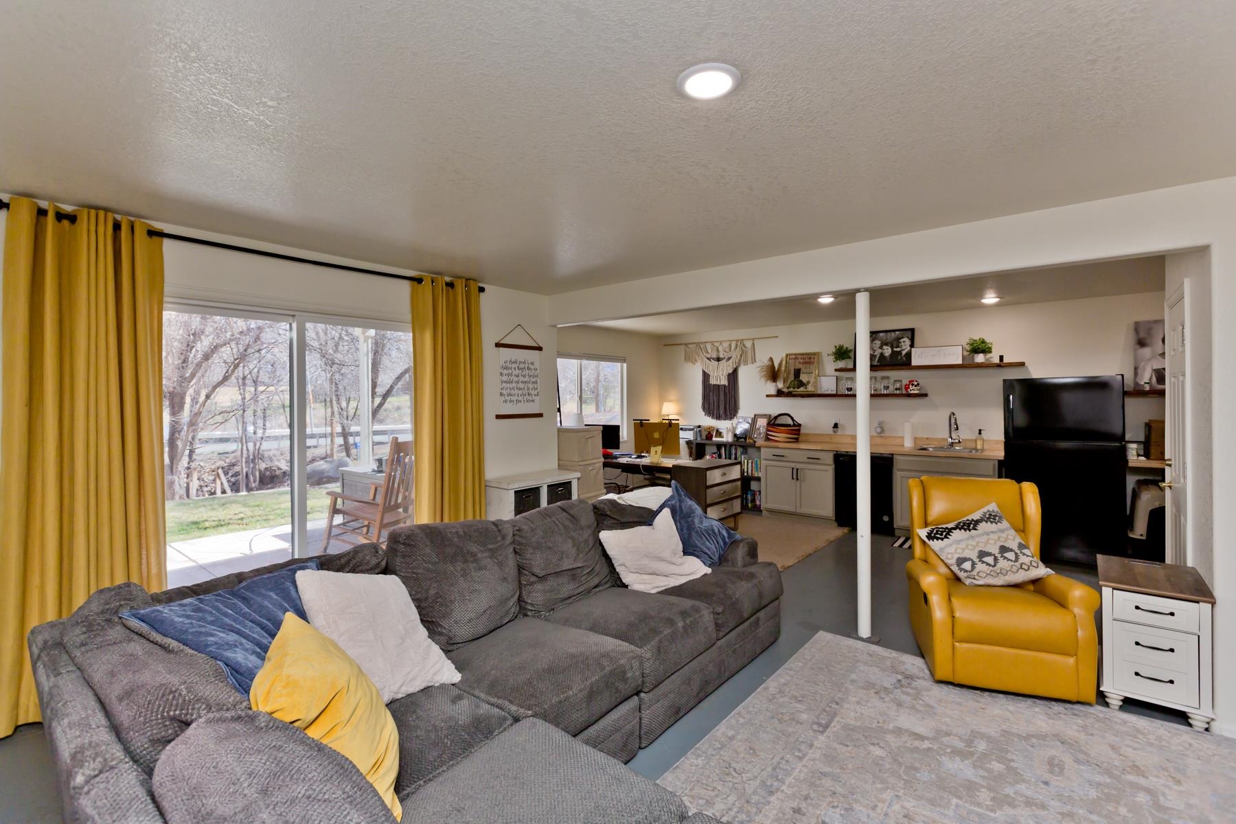 528 Park Ridge Court Grand Junction, CO 81507 - Photo 25 of 42 a living room with furniture kitchen view and a large window