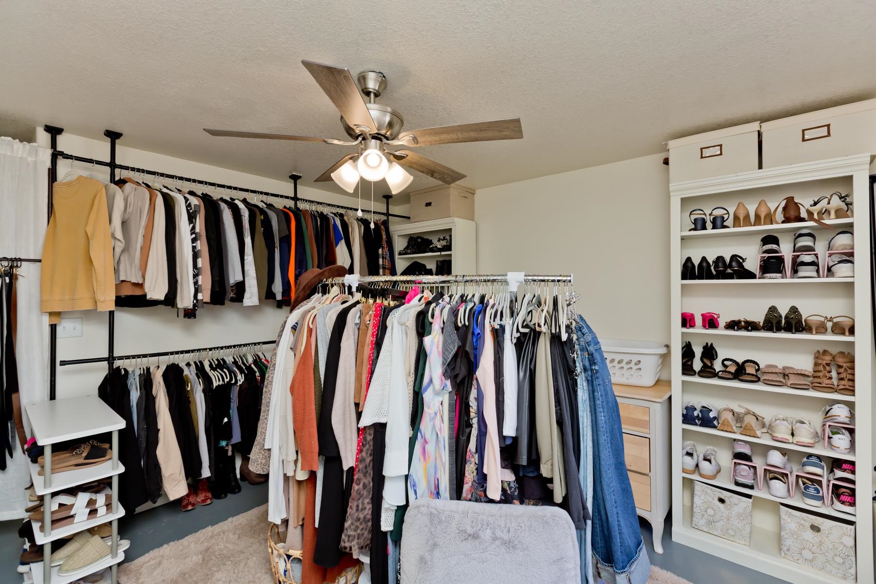 528 Park Ridge Court Grand Junction, CO 81507 - Photo 31 of 42 a view of walk in closet with clothes and shoes