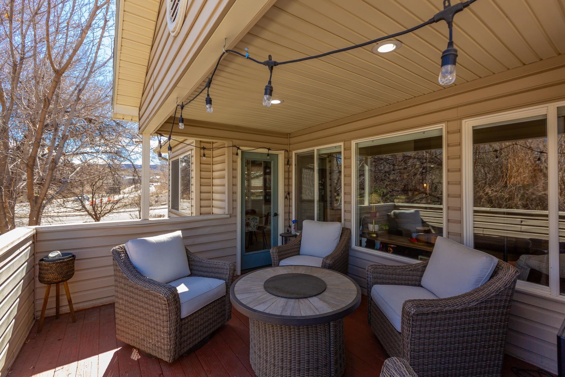 528 Park Ridge Court Grand Junction, CO 81507 - Photo 35 of 42 a living room with furniture and a floor to ceiling window