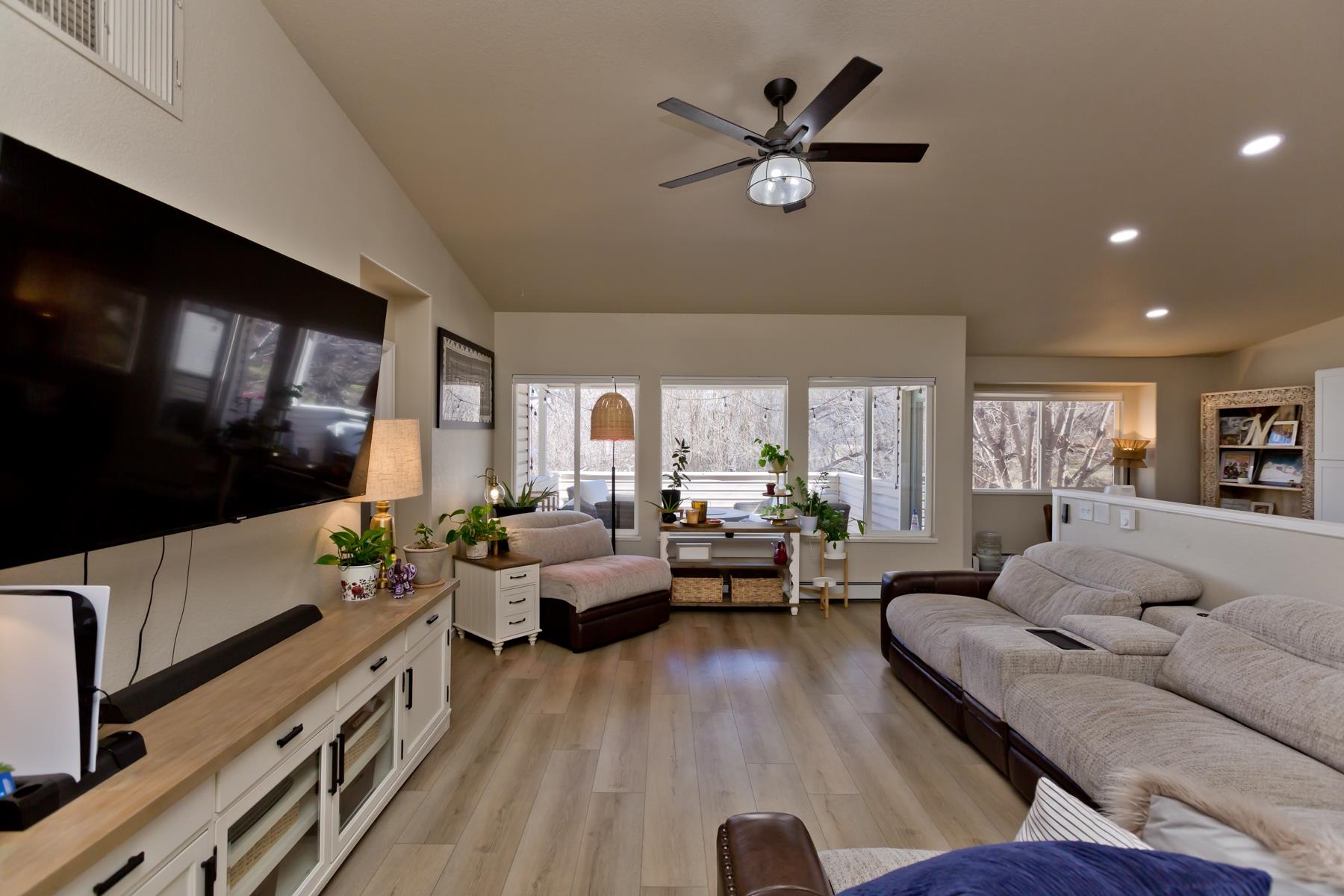 528 Park Ridge Court Grand Junction, CO 81507 - Photo 8 of 42 a living room with furniture and a flat screen tv