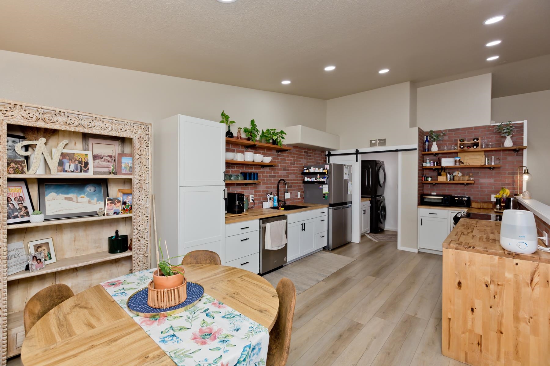 528 Park Ridge Court Grand Junction, CO 81507 - Photo 10 of 42 a kitchen with stainless steel appliances wooden floor and large refrigerator
