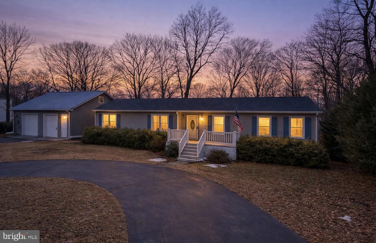 31729 West Edge Road Millington, MD 21651 - Photo 1 of 5 a front view of a house with garden