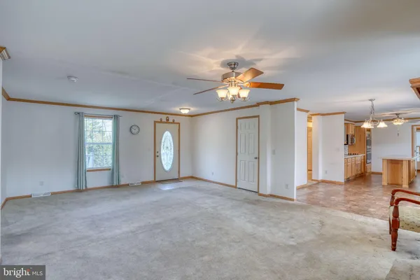 a kitchen with stainless steel appliances granite countertop a refrigerator a sink a stove and island