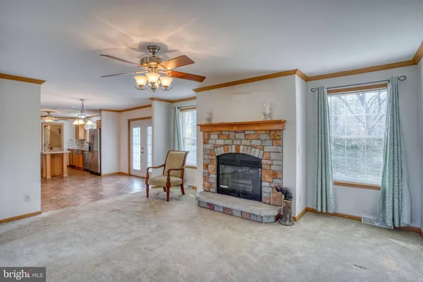 a kitchen with cabinets and chandelier
