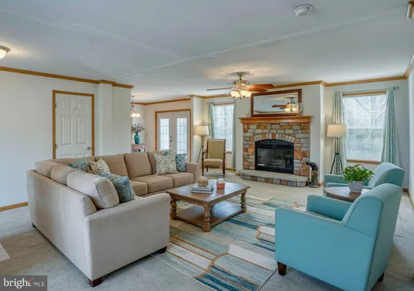an empty room with furniture and a fireplace