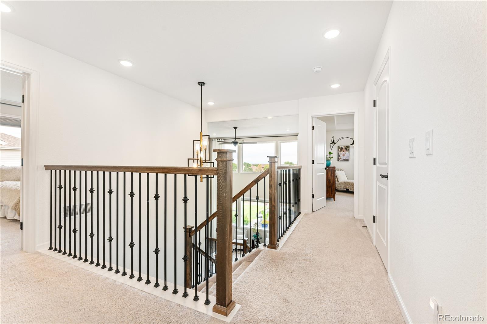16391 Buffalo Run Drive Commerce City, CO 80022 - Photo 21 of 49 en empty room with stairs