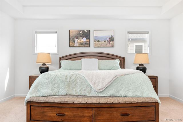 a bedroom with a bed and night stand