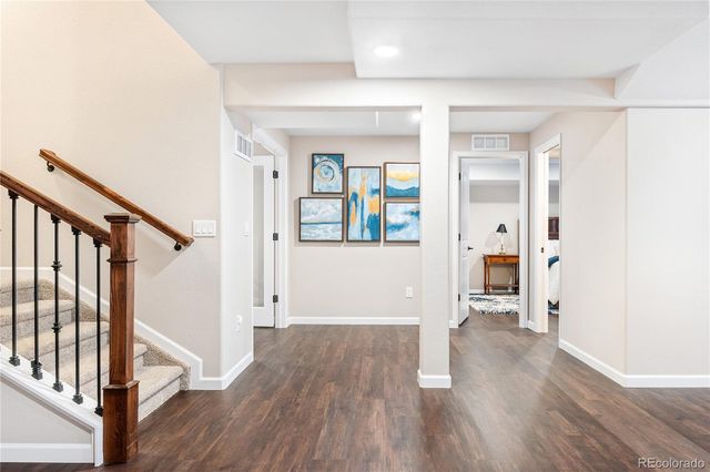 wooden floor with white walls