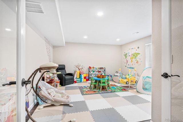 a view of kids room with toys and toys