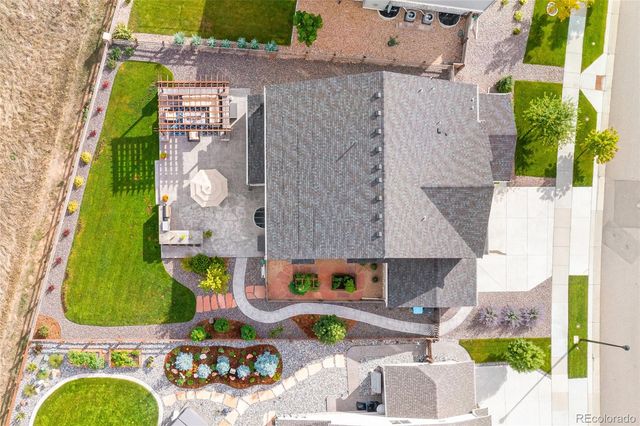 an aerial view of a house with a swimming pool