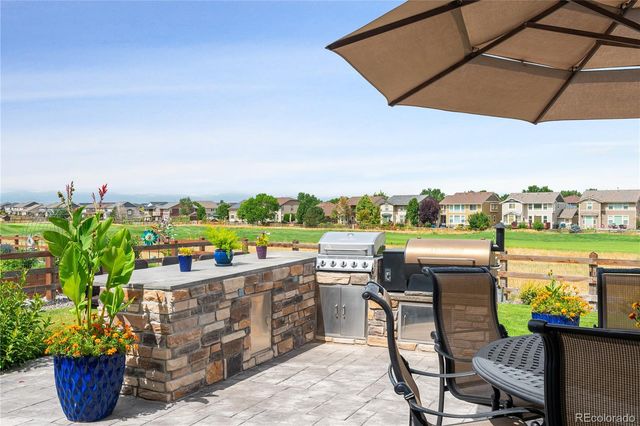 a view of a terrace with furniture and garden