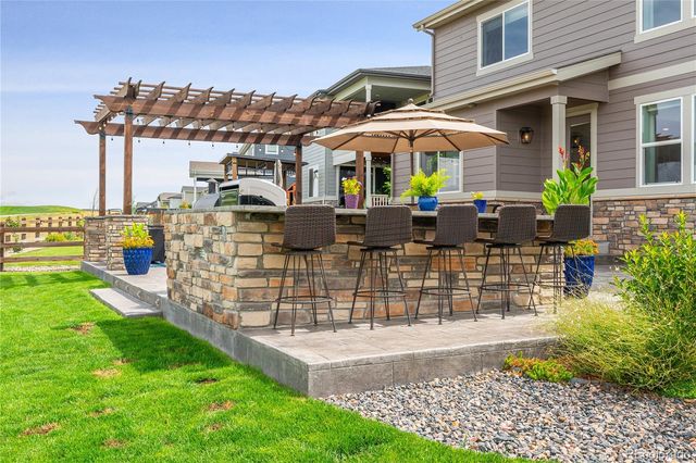 a view of house with outdoor seating