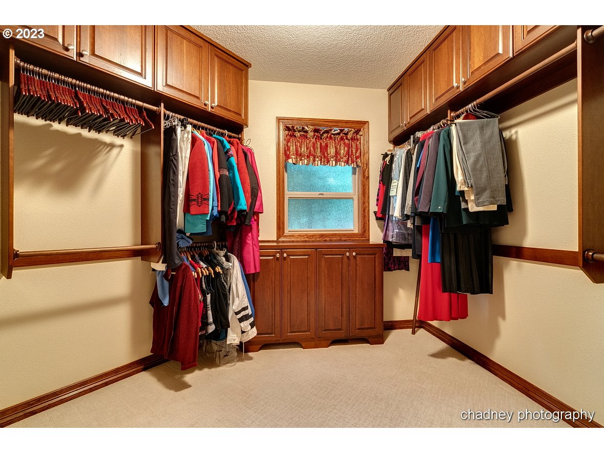 13507 Southeast Richey Road Boring, OR 97009 - Photo 17 of 34 a view of walk in closet with clothes