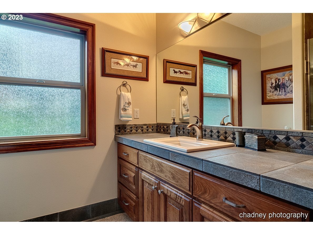 13507 Southeast Richey Road Boring, OR 97009 - Photo 22 of 34 a bathroom with a sink and a mirror