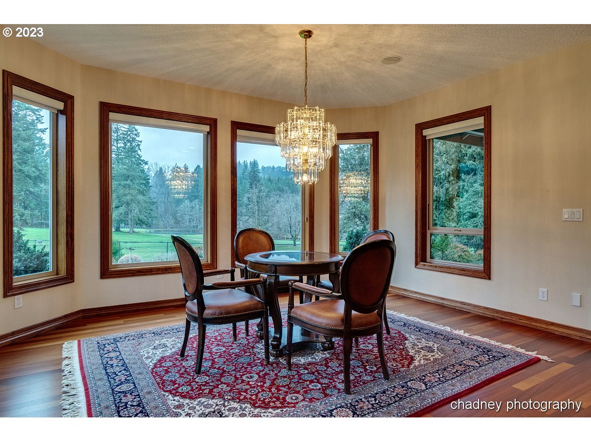 13507 Southeast Richey Road Boring, OR 97009 - Photo 10 of 34 a dining room with furniture a chandelier and wooden floor