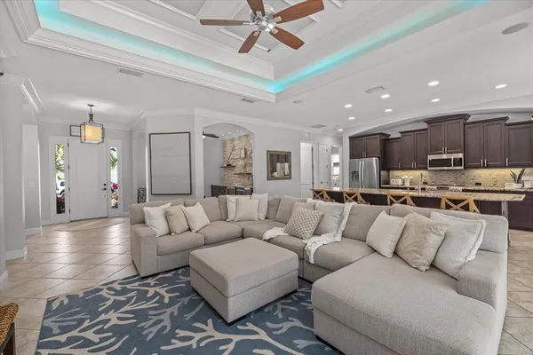 a kitchen with stainless steel appliances a refrigerator and a dining table