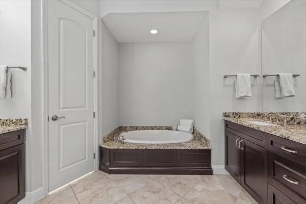 a bathroom with a sink toilet and mirror
