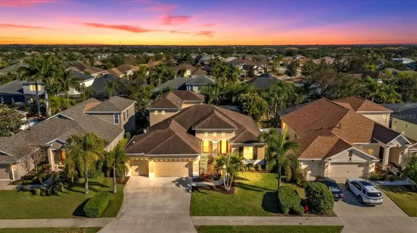 an aerial view of residential houses with outdoor space