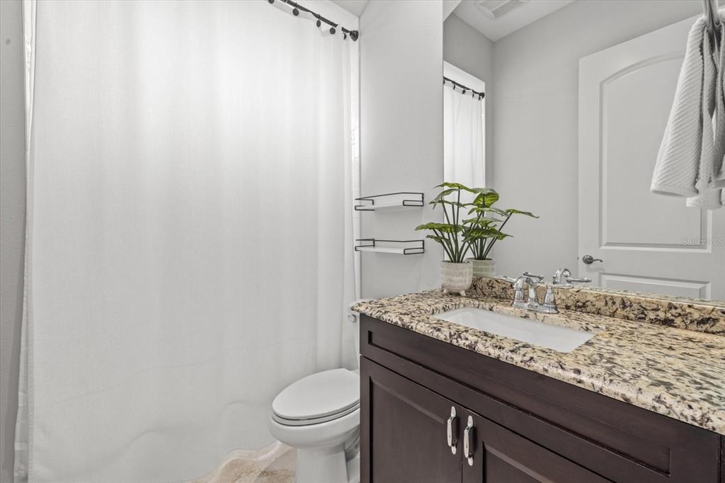 4727 Balboa Park Loop Bradenton, FL 34211 - Photo 31 of 56 a bathroom with a granite countertop sink and a mirror