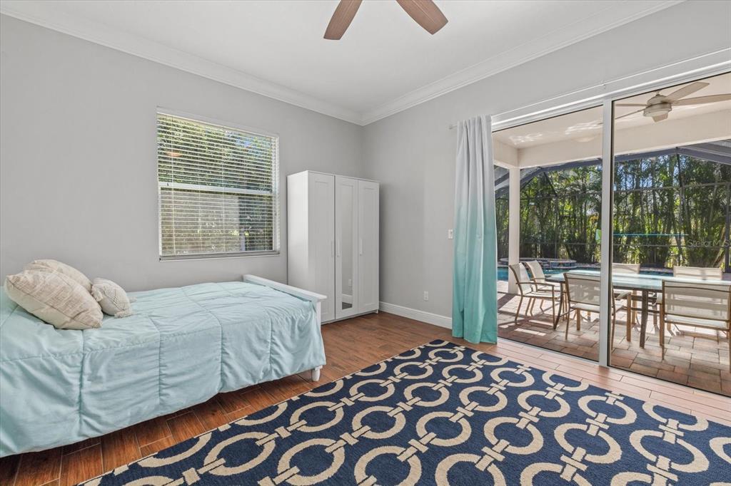 4727 Balboa Park Loop Bradenton, FL 34211 - Photo 33 of 56 a bedroom with a bed and a large window