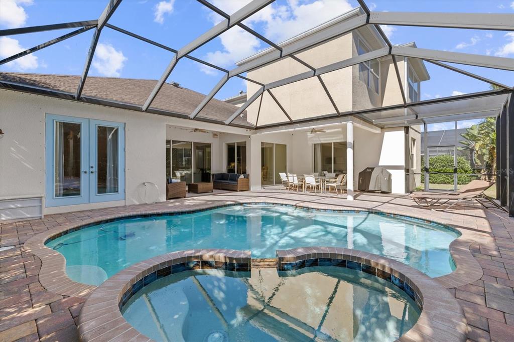 4727 Balboa Park Loop Bradenton, FL 34211 - Photo 43 of 56 a view of a swimming pool with a lounge chairs