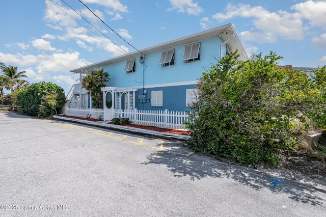 a house view with a garden space