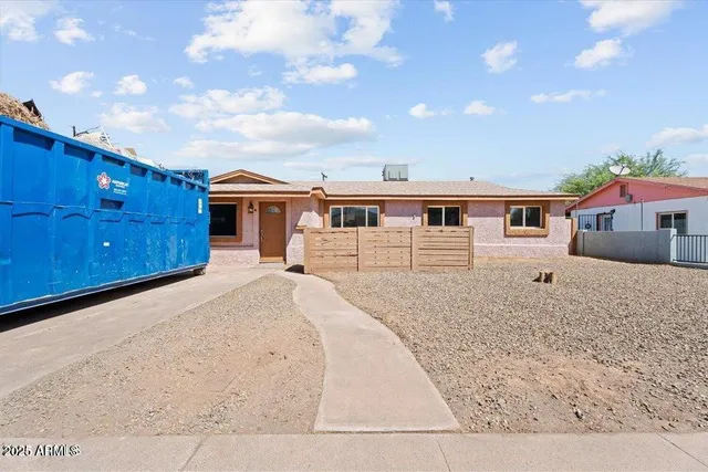 a view of wooden deck and a yard