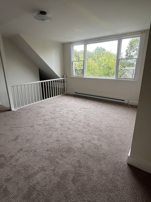 52 Pleasant Street, Unit 2 Lexington, MA 02421 - Photo 5 of 13 an empty room with windows