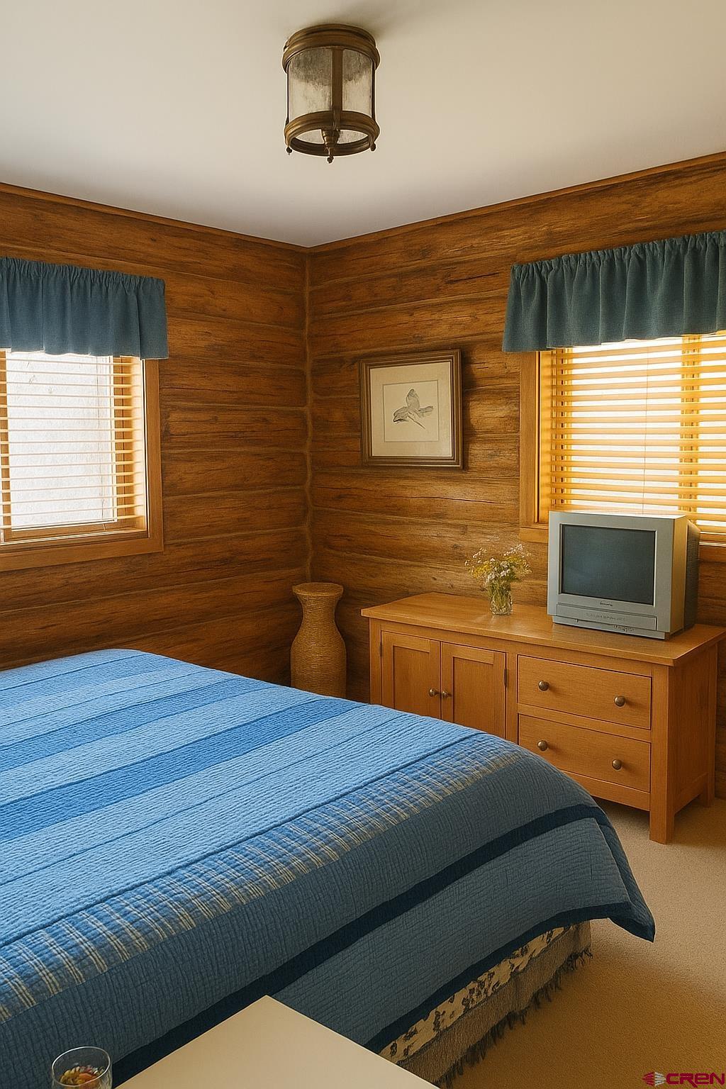 76 Tower Road South Ridgway, CO 81432 - Photo 15 of 37 a bedroom with a bed and wooden floor