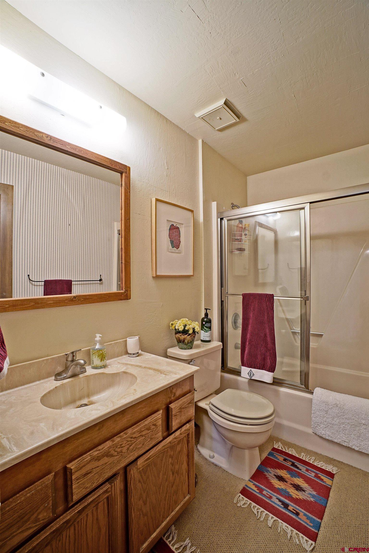 76 Tower Road South Ridgway, CO 81432 - Photo 16 of 37 a bathroom with double sink and a mirror
