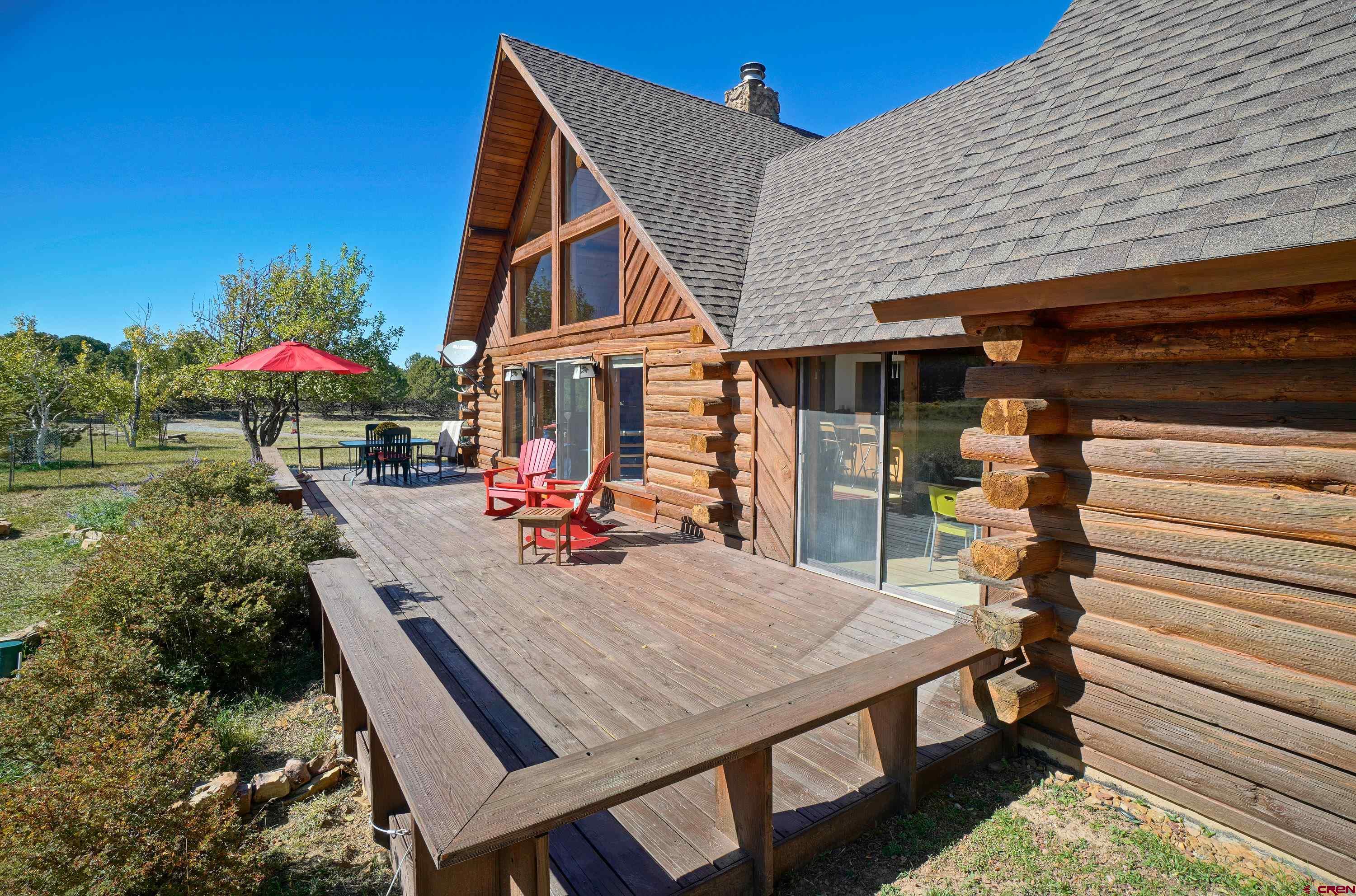 76 Tower Road South Ridgway, CO 81432 - Photo 27 of 37 a view of a house with backyard and sitting area