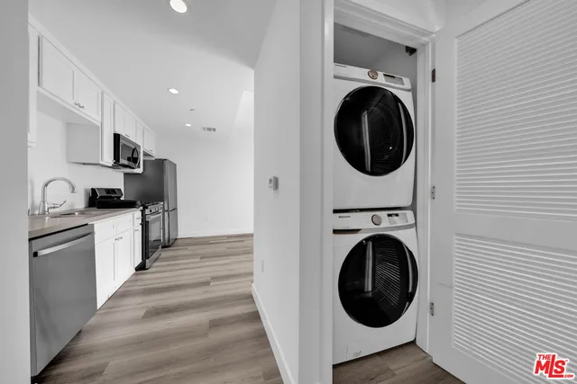 a view of a kitchen with washer and dryer