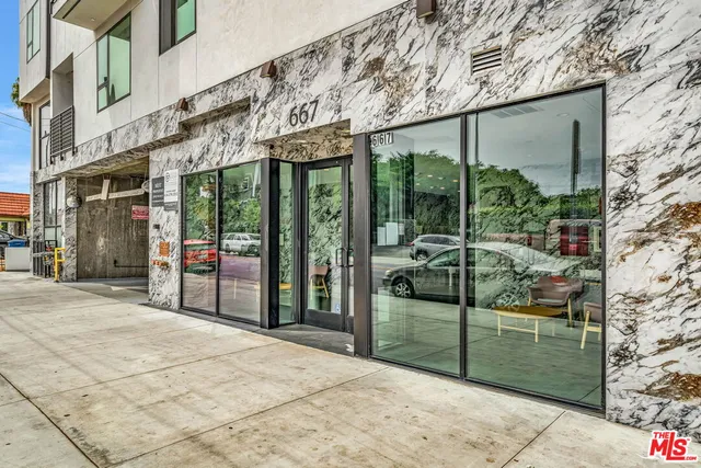 a view of a building with a garden
