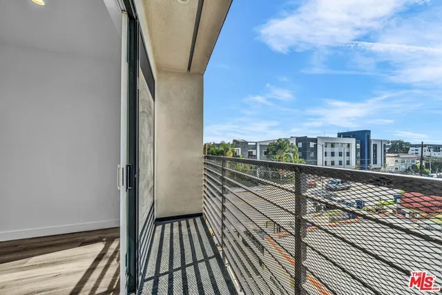 a view of balcony with wooden floor