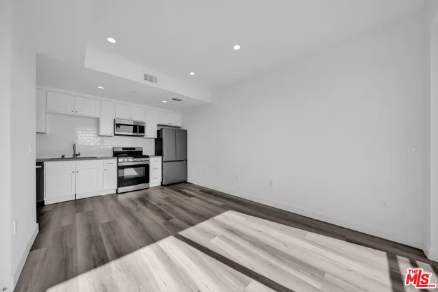 a view of kitchen with wooden floor