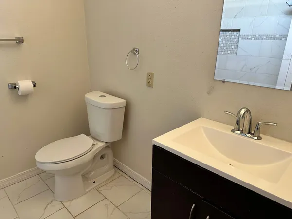a bathroom with a sink and a toilet