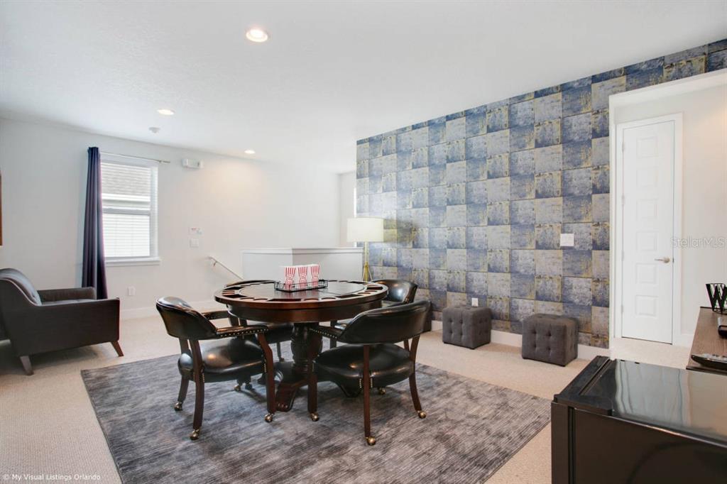 7736 Graben Street Kissimmee, FL 34747 - Photo 15 of 62 a view of a dining room with furniture