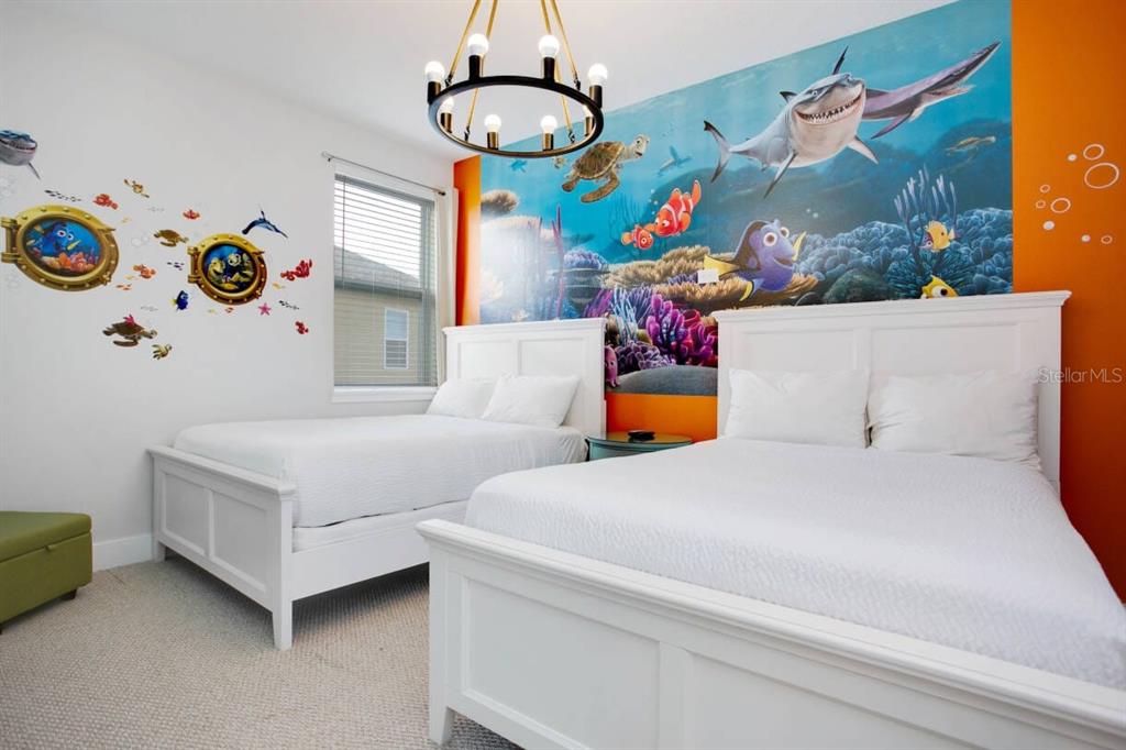 7736 Graben Street Kissimmee, FL 34747 - Photo 21 of 62 a bedroom with a bed and a window