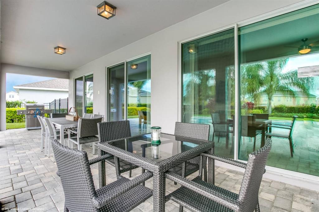 7736 Graben Street Kissimmee, FL 34747 - Photo 34 of 62 a view of an outdoor dining space with furniture