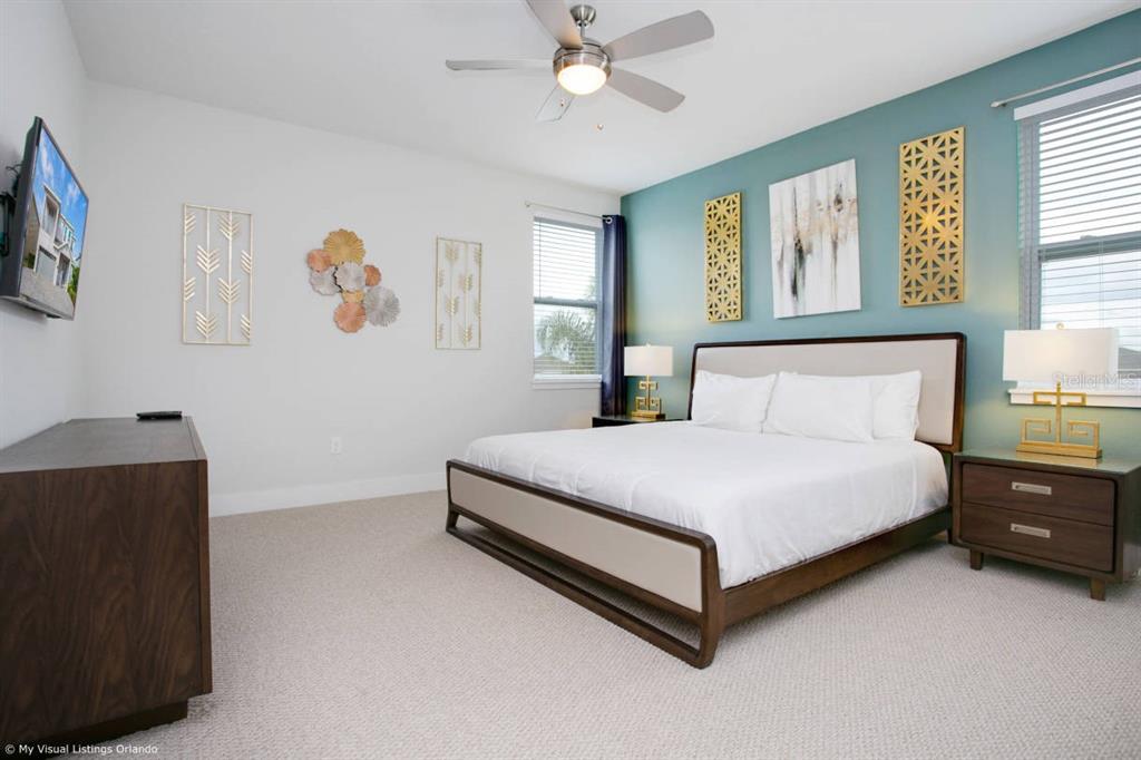 7736 Graben Street Kissimmee, FL 34747 - Photo 48 of 62 a bedroom with a bed and window