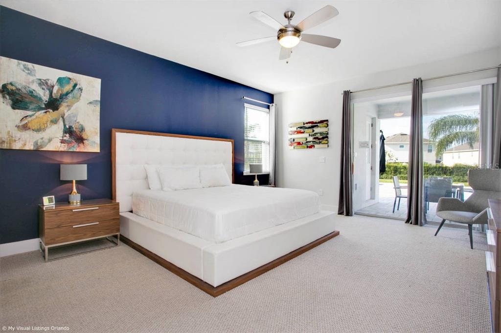 7736 Graben Street Kissimmee, FL 34747 - Photo 51 of 62 a large white bed sitting in a room next to a window