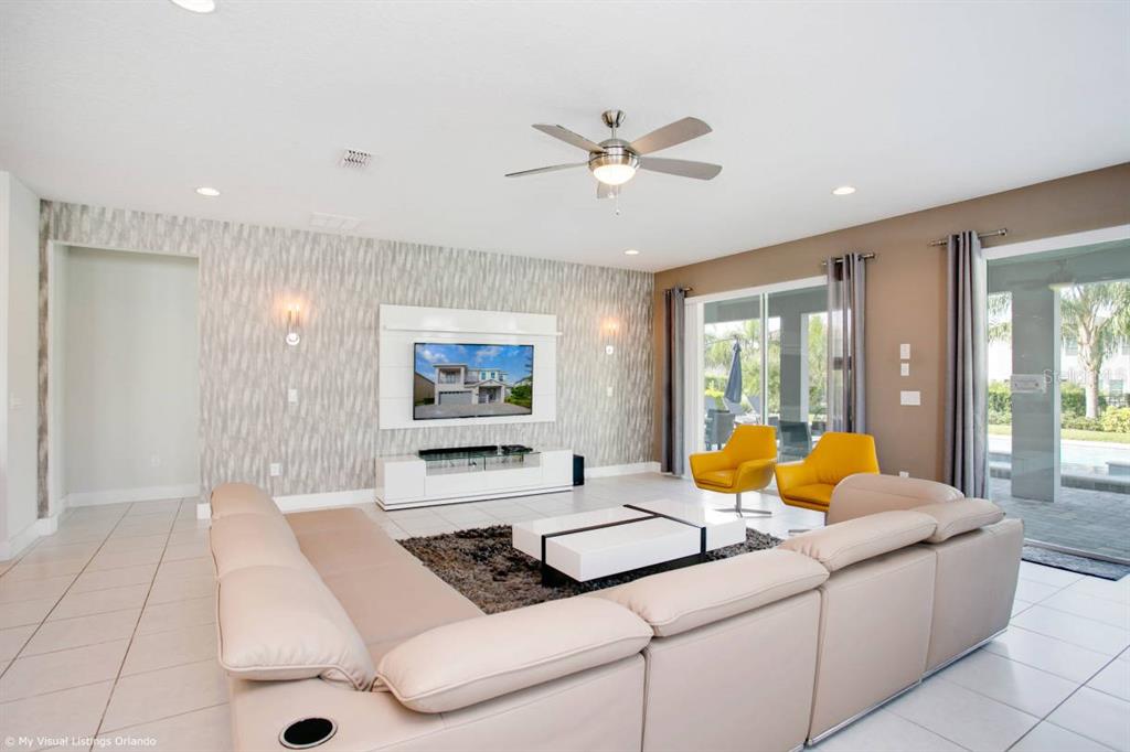 7736 Graben Street Kissimmee, FL 34747 - Photo 53 of 62 a living room with furniture and large windows