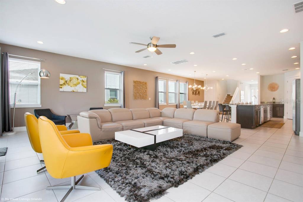 7736 Graben Street Kissimmee, FL 34747 - Photo 60 of 62 a living room with furniture and a table