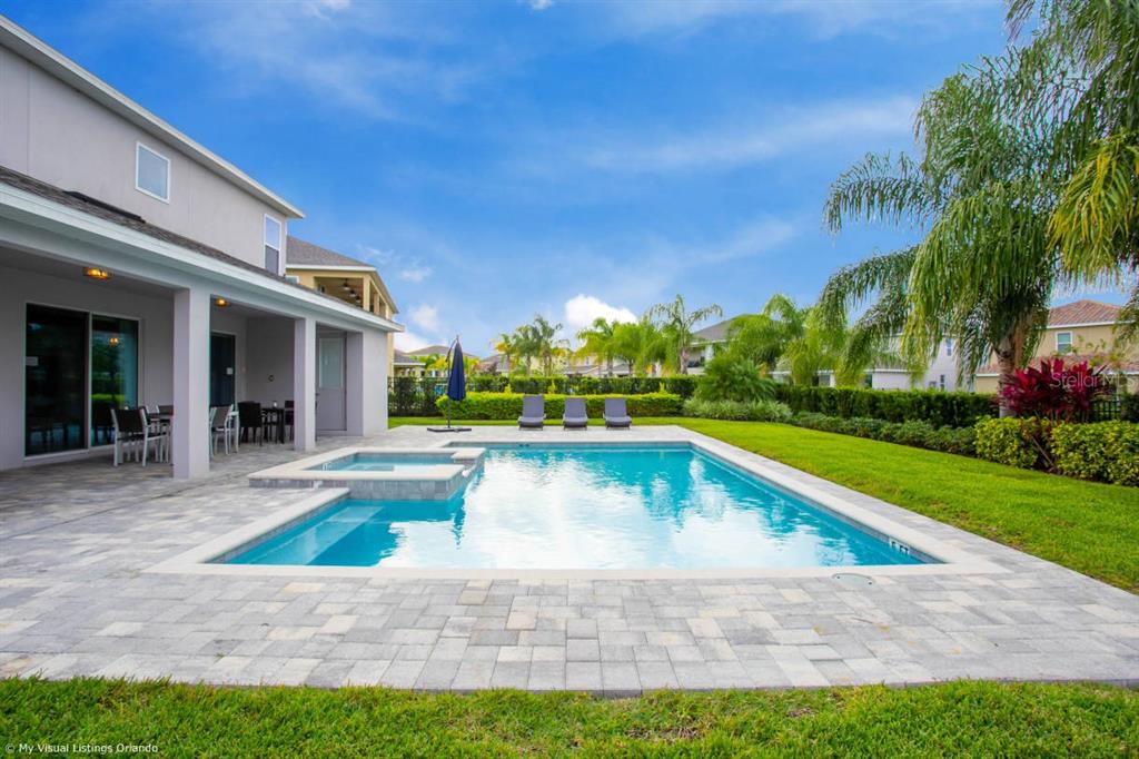 7736 Graben Street Kissimmee, FL 34747 - Photo 7 of 62 a view of an house with swimming pool and yard
